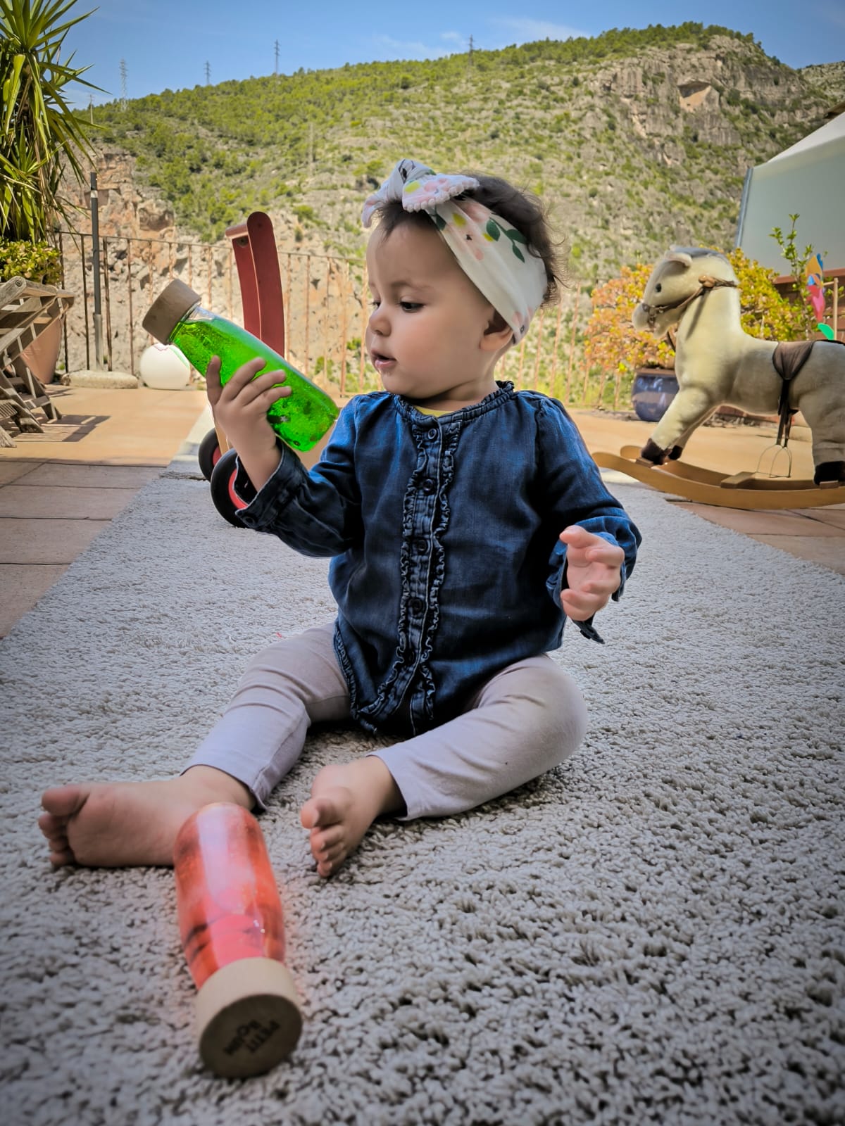 Baby with sensory bottle